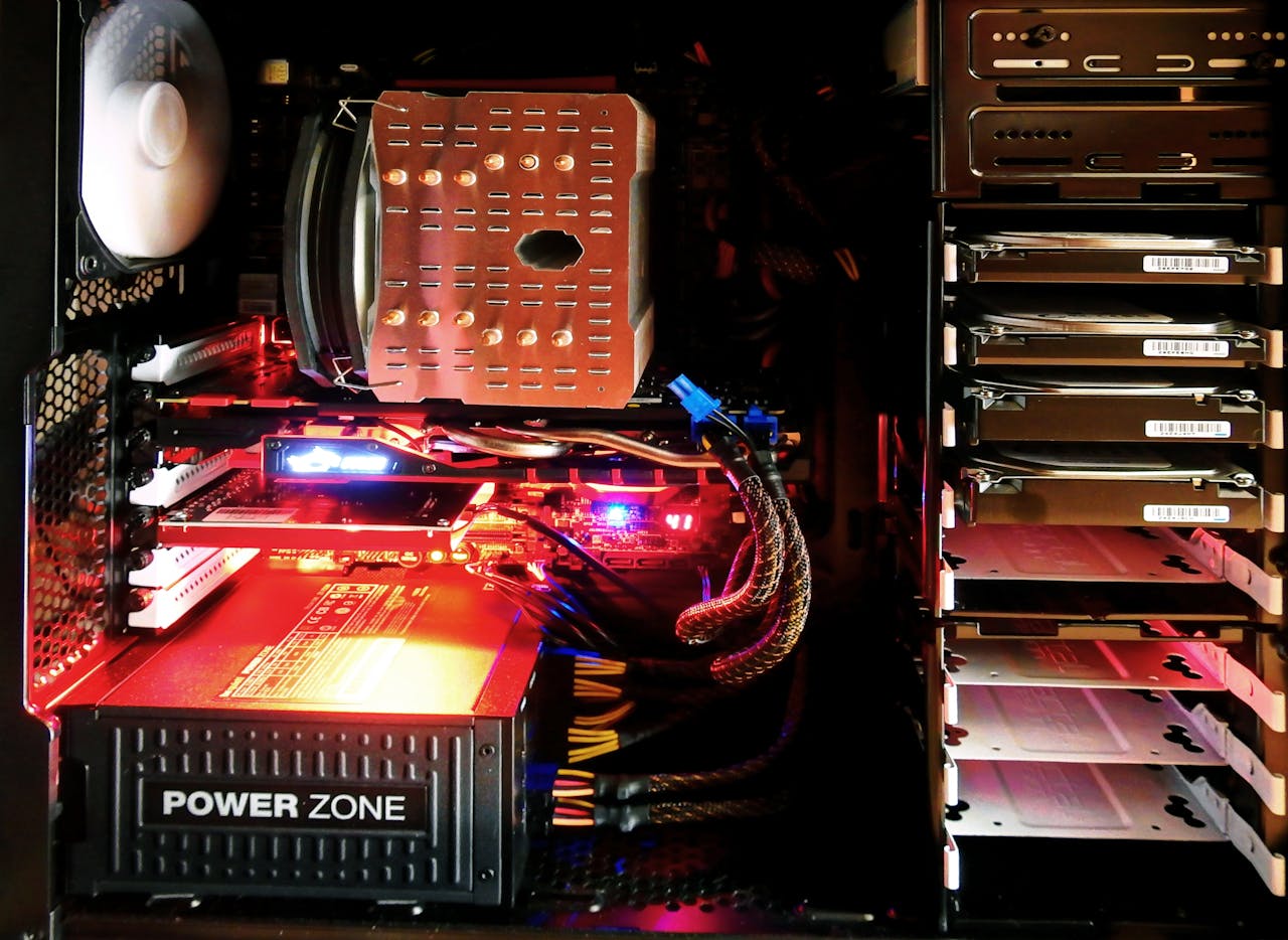 Close-up of a custom gaming PC with RGB lighting, showcasing power supply and components.